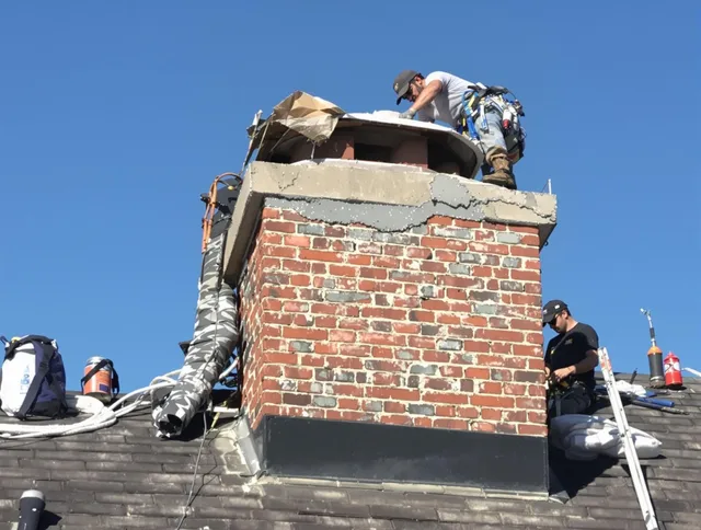 Bristol Chimney Sweep installing a custom chimney crown in Bristol, RI