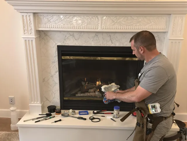 Bristol Chimney Sweep performing fireplace maintenance in Bristol, RI