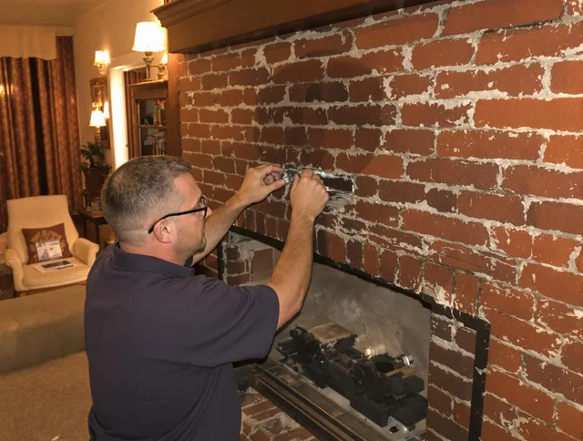 Bristol Chimney Sweep expert fixing a fireplace in Bristol, RI